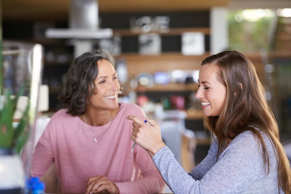 mother and daughter bonding in a cafe, concept of family relationships